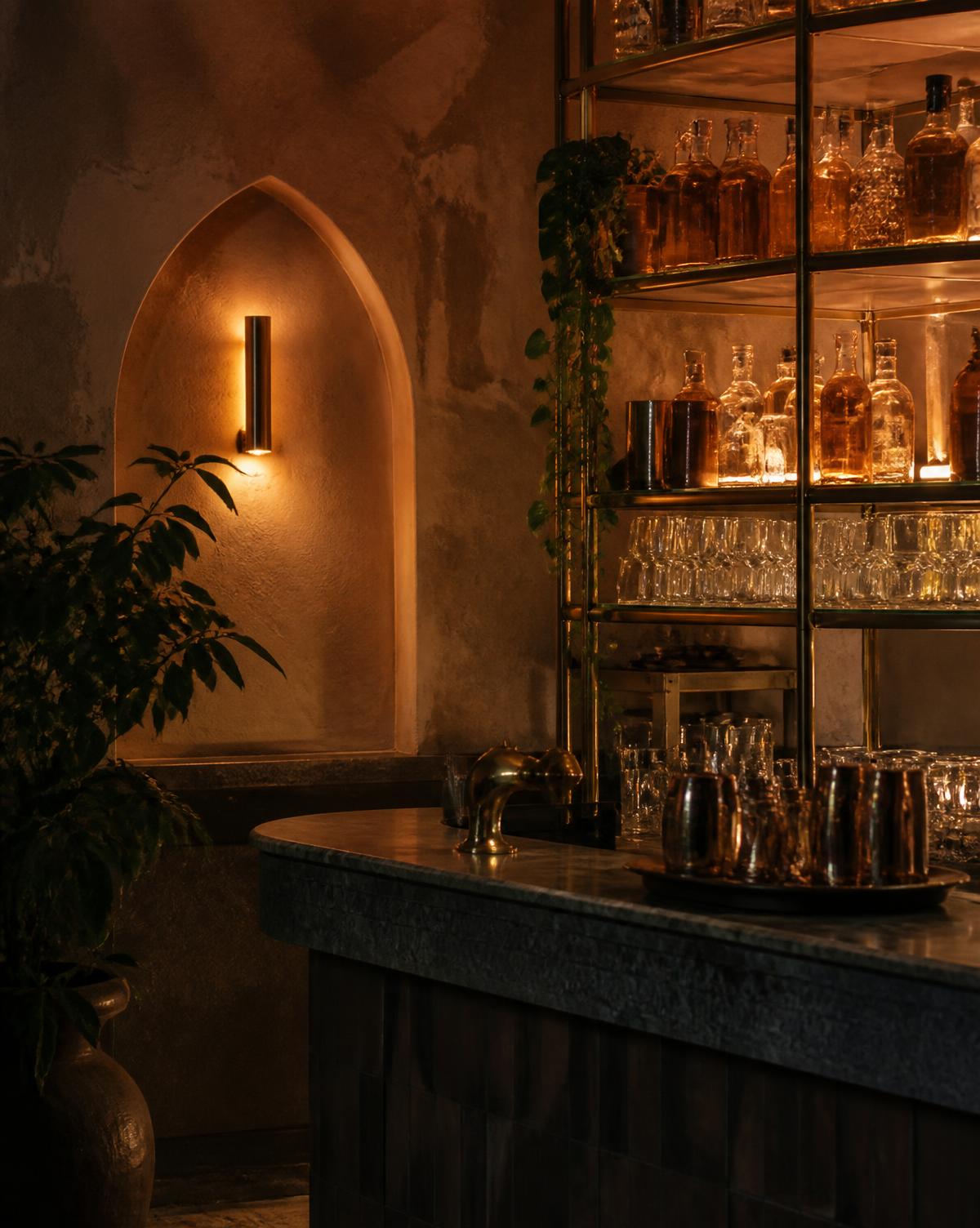 Brass bar shelving lit low in the evening